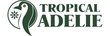 The brand logo for Tropical Adelie, featuring a penguin and floral leaf design on the left, and the brand name text on the right.