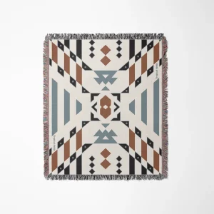 Tropical Adelie "Wandering Warrior" woven throw blanket featuring a symmetrical geometric Southwestern or tribal-inspired pattern in terracotta brown, slate blue, black, and cream, finished with colorful fringed edges.